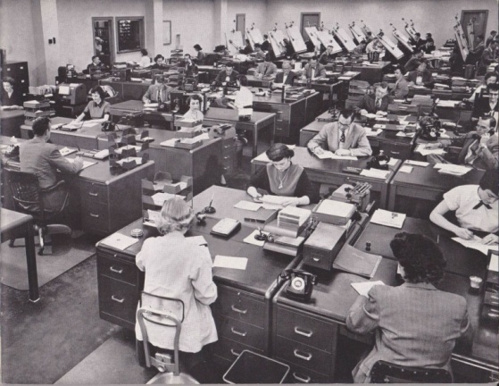 A vintage Woodward office picture showing the drafting, sales and purchasing area.